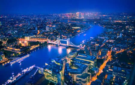 City of London at sunset. View include modern skyscrapers, banks and office buildings, river Thames, Tower bridge.のeditorial素材