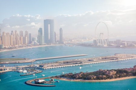 Dubai Marina. Beaches and Dubai eye view at sunset with boats and yachts in the Persian gulf waters. Dubai, UAE.のeditorial素材