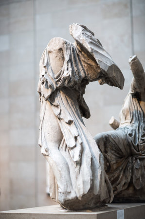 London, UK - October 20, 2022: Woman's figure from  Acropolis of Athens. Life-size pediment...