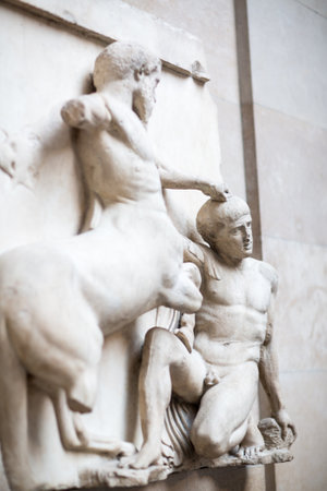 London, UK - October 20, 2022:  Centauromachy, battle Centaur and a Lapith. Metopes, detail of Parthenon frieze.のeditorial素材