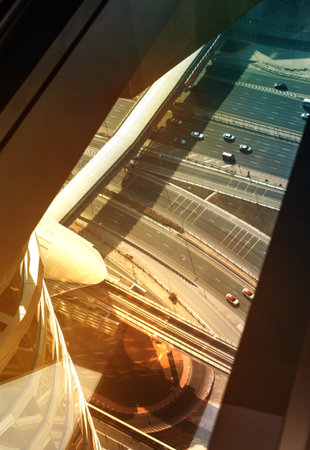 Dubai, UAE - September 2, 2022: Look down from floor window at motorway junction of Sheikh Zayed...