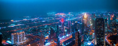 Dubai, UAE - August 28, 2022: Dubai city at night, view with lit up skyscrapers and roads.のeditorial素材