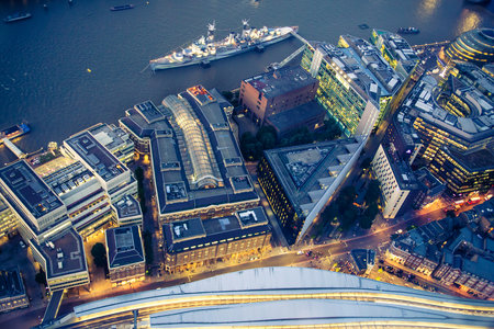 London, UK - 23 July, 2019: Look down at River Thames and, Tower bridge and Belfast ship at night. London, UKのeditorial素材