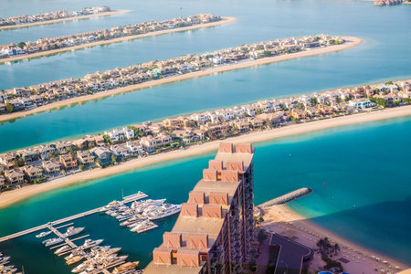 Dubai, UAE - August 28, 2022: Holiday villas at Palm Jumeirah view with beautiful reflection in water. Dubai, UAE.のeditorial素材