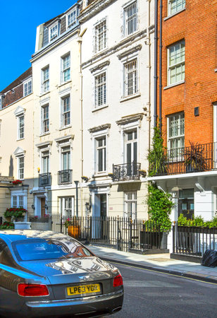 London, UK - 9 September, 2023: Beautiful periodic buildings at Mayfair and luxury cars parked at road. Mayfair one of the richest areas to live with fancy lifestyleのeditorial素材