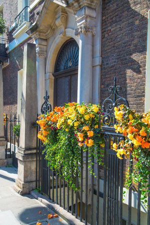 London, UK - 9 September, 2023: Beautiful entrance door of periodic building in Mayfair decorated with flowers, Mayfair one of the richest areas to live with fancy lifestyleのeditorial素材