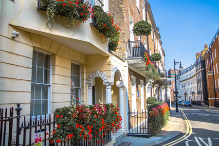 London, UK - 9 September, 2023: Beautiful entrance door of periodic building in Mayfair decorated with flowers, Mayfair one of the richest areas to live with fancy lifestyleのeditorial素材