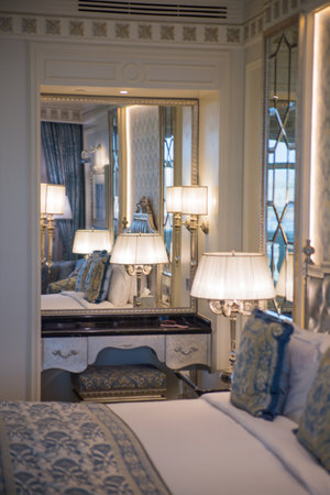 Dubai, United Arab Emirates - August 22, 2023: Beautiful bedroom, interior lights with park viewのeditorial素材
