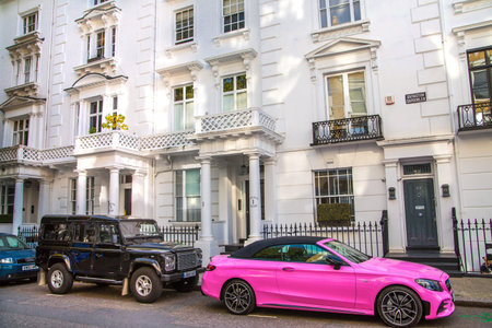 London, UK - 9 September, 2023: Beautiful Kensington streets with periodic buildings and luxury cars...