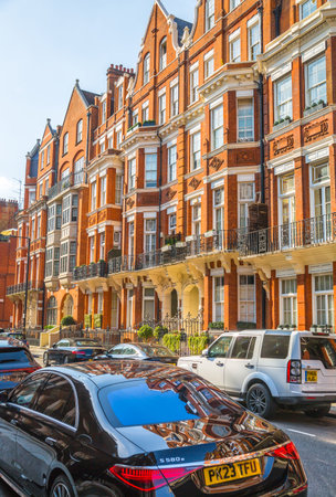 London, UK - 9 September, 2023: Beautiful Kensington streets with periodic buildings and luxury cars parked on street. Kensington one of the richest areas to live with fancy lifestのeditorial素材