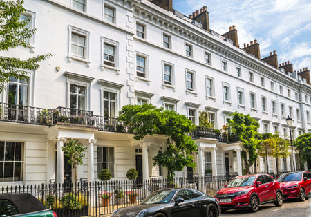 London, UK - 9 September, 2023: Door entrance decorated with flowers in periodic building of Chelsea, one of the richest areas to live with fancy lifestyle. London street photograpのeditorial素材