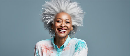 Portrait of very beautiful middle age woman with grey hair sliming to camera.の素材