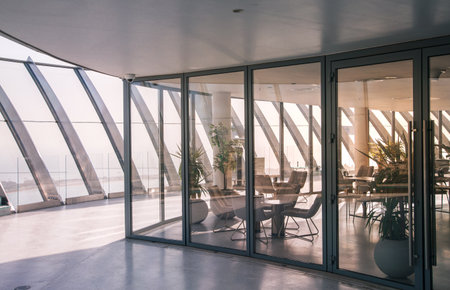 Dubai, UAE - August 28, 2022: Top floor cafe with panoramic view at marina at sunsetのeditorial素材