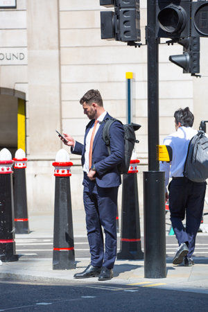 London, UK - 7 May, 2024: City of London, people walking at Bank of England squareのeditorial素材
