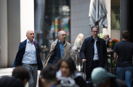 London, UK - 7 May, 2024: Business people walking next to Lloyd's building entrance at Lime Street in the City of Londonのeditorial素材