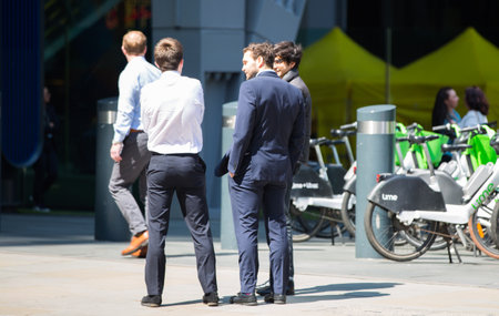 London, UK - 7 May, 2024: Business people walking next to Lloyd's building entrance at Lime Street in the City of Londonのeditorial素材