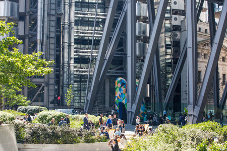 London, UK - 7 May, 2024: Business people walking next to Lloyd's building entrance at Lime Street in the City of Londonのeditorial素材