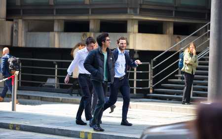 London, UK - 7 May, 2024: Business people walking next to Lloyd's building entrance at Lime Street in the City of Londonのeditorial素材
