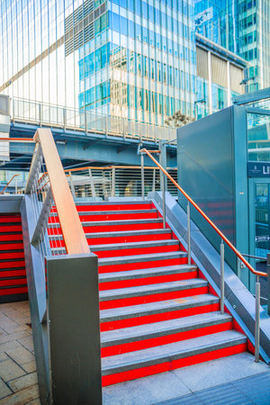 London, UK - June 14, 2025: South dock in Canary Wharf at sunset. New residential developmentのeditorial素材