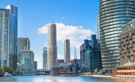 London, UK - June 14, 2025: Millwall dock at sunset, panoramic view with residential skyscrapersのeditorial素材