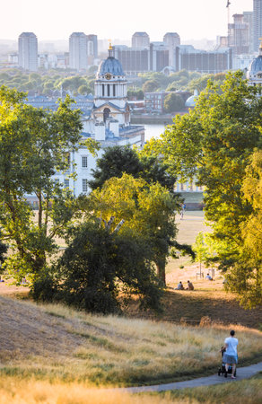 London, UK - 25 October, 2025:   Canary Wharf banking and business area at sunset , view from the Greenwich hill.のeditorial素材