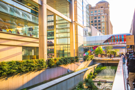 London, UK - 14 June, 2025: Eden dock view with corporate buildings in Canary Wharf at sunset.のeditorial素材