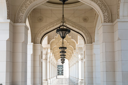 UAE, Abu Dhabi - August 22, 2024: Beautiful interior of  marble palace with magnificent golden dome and geometrical ornamentsのeditorial素材