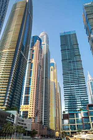 UAE, Dubai - August 26, 2024: Dubai Marina skyscrapers and Dubai beach view from boat