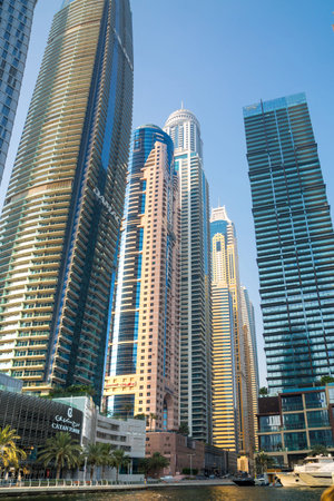 UAE, Dubai - August 26, 2024: Dubai Marina skyscrapers and Dubai beach view from boat
