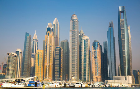 UAE, Dubai - August 26, 2024: Dubai Marina skyscrapers and Dubai beach view from boat