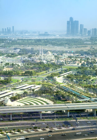 Dubai, UAE - 24 August, 2024: Panorama of New Dubai downtown with iconic skyscrapers, Burj Khalifa and roads junctions aerial viewのeditorial素材