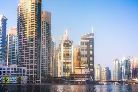 UAE, Dubai - August 26, 2024: Dubai Marina skyscrapers and Dubai beach view from boat