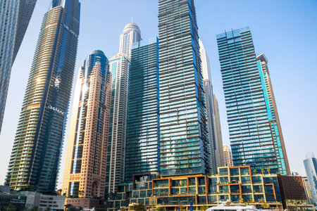 UAE, Dubai - August 26, 2024: Dubai Marina skyscrapers and Dubai beach view from boat