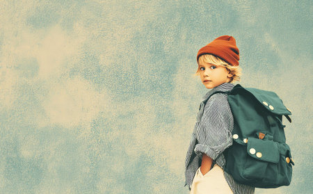 Child with backpack. Portrait of a boy with a backpack.の素材