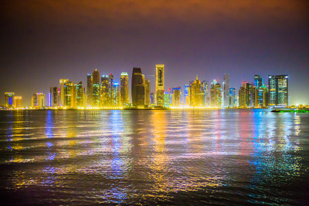 Qatar, Doha - September 7, 2025: Doha city center with skyscrapers night view with beautiful...