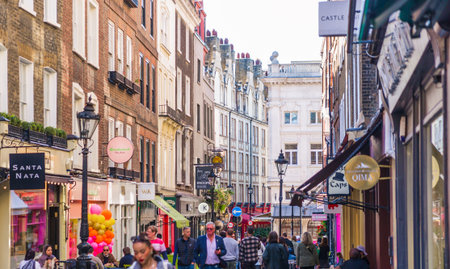 London, UK - September 25, 2025: Public houses, cafes and restaurants in West End, people walking, relaxing and drinking outsideのeditorial素材