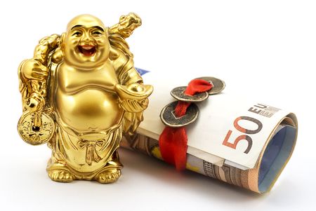 Gold laughing Buddha with money and chinese coinsの写真素材