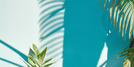Blurred shadow from palm leaves on the light blue wallの素材
