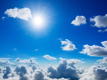 White fluffy clouds in blue sky with sun rays. Nature background.の素材