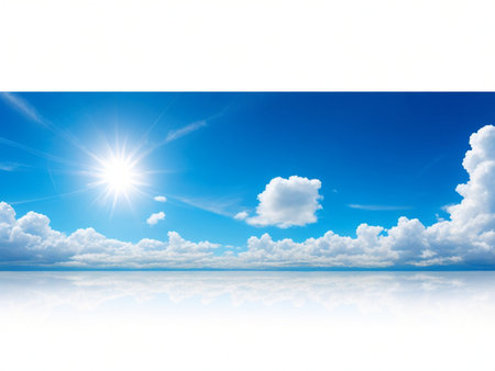 Blue sky background with white clouds and sun. Copy space for your text.の素材