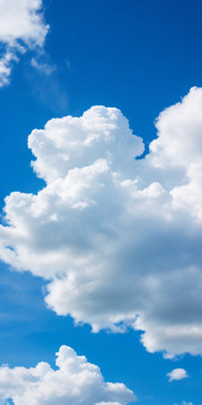 Blue sky background with white clouds. Cumulus white clouds in the blue sky.の素材
