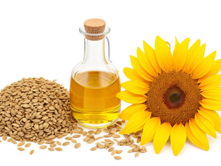 sunflower oil and sunflower seeds isolated on a white background.の素材