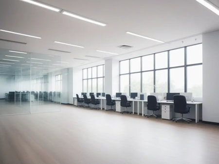 Interior of modern open space office with white walls, wooden floor and rows of black computer desks. 3d renderingの写真素材