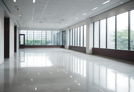 interior of modern office building with glass wall and white floor.