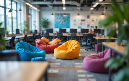Modern co-working space with colorful chairs and computers. Blurred backgroundの写真素材