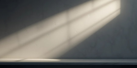 Empty table with shadow from the window on the wall. 3d renderingの写真素材