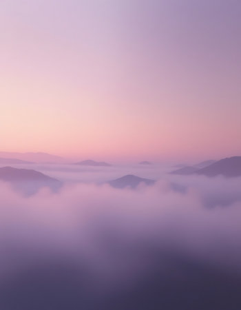 Foggy sunrise in the mountains. Landscape with fog and clouds.の写真素材