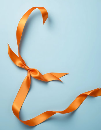 Curly orange ribbon on blue background. Top view. 3d illustrationの写真素材
