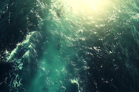Blue sea water surface with sun rays. 3d rendering toned imageの写真素材
