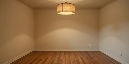 Empty room with beige walls and wooden floor. Nobody inside.の写真素材